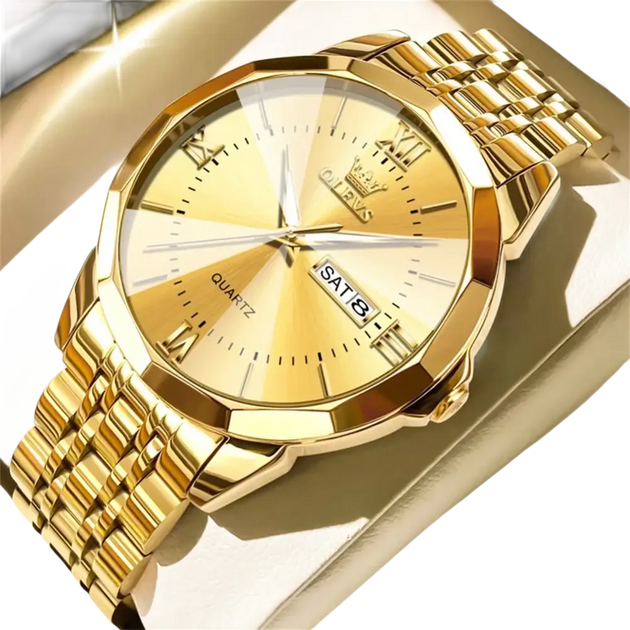 Une montre-bracelet pour homme en or brillant avec un bracelet en métal et un affichage de la date du jour.