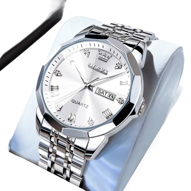 Montre à quartz pour homme, de couleur argentée, avec lunette multifacettes, index en diamants et affichage de la date et du jour.