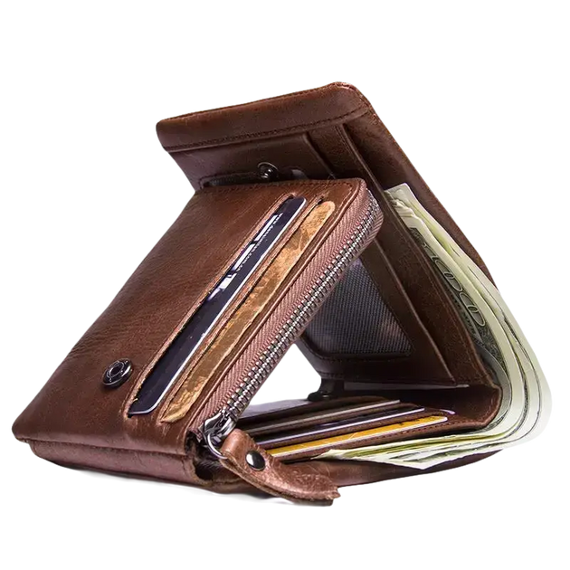 Un portefeuille bifold en cuir marron rempli d’argent liquide et de cartes.